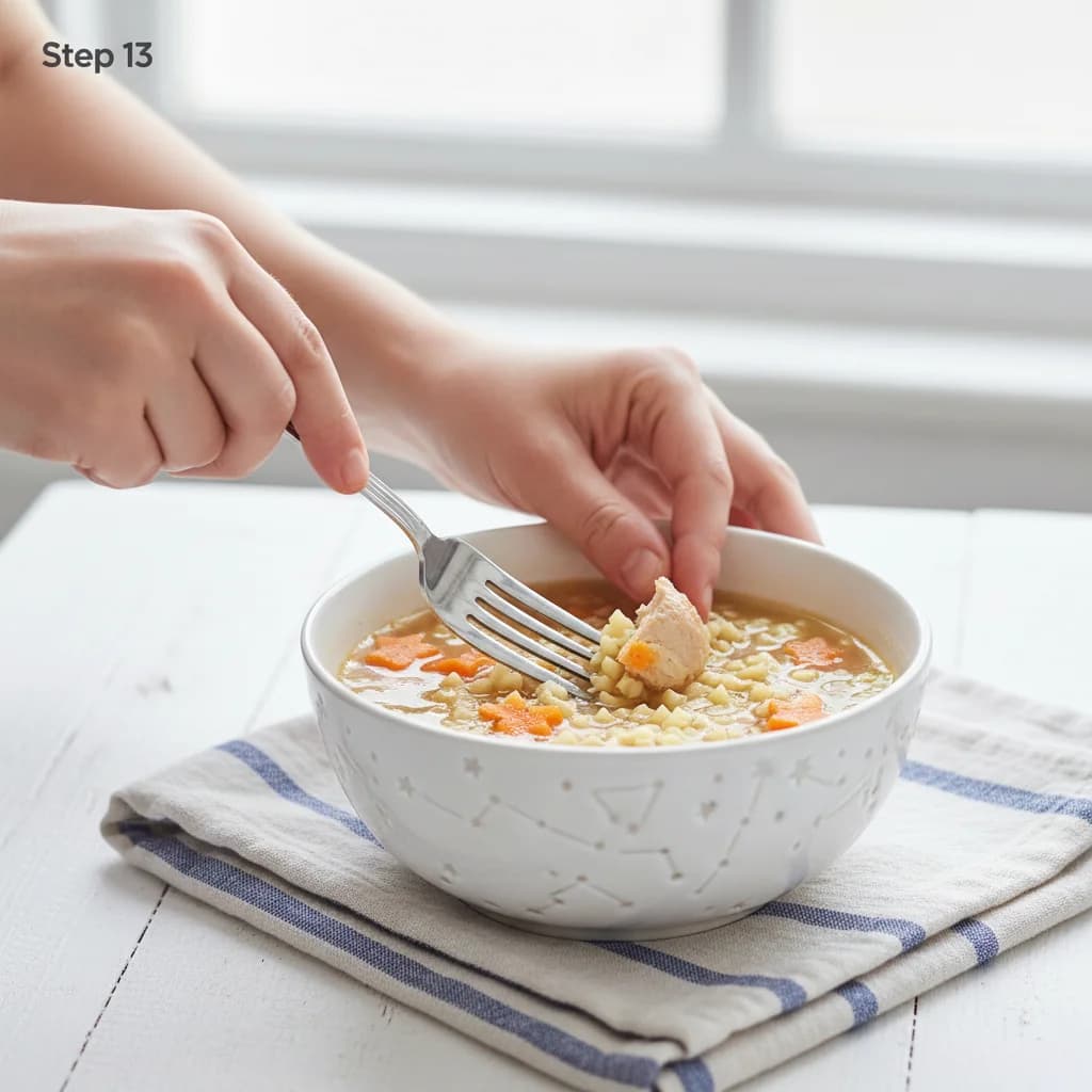 Step 13: Before serving, you can mash some of the carrot or lightly shred the chicken pieces with a fork to m for Tiny Chicken Noodle Soup Stars